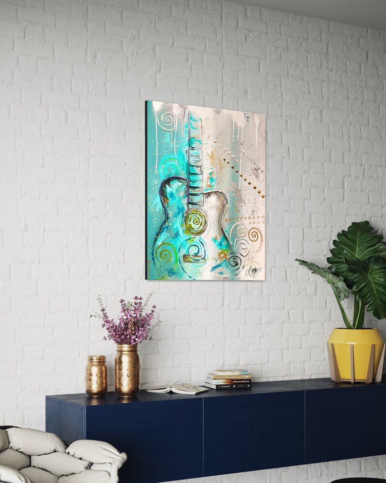 May include: Abstract painting of a teal blue acoustic guitar with white and gold accents on a light blue and beige background.