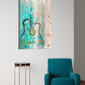 May include: Abstract painting of a teal acoustic guitar with white and gold accents on a light gray background.