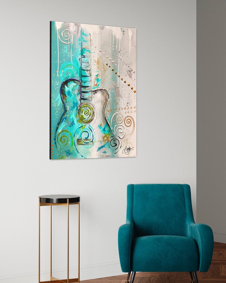 May include: Abstract painting of a teal acoustic guitar with white and gold accents on a light gray background.