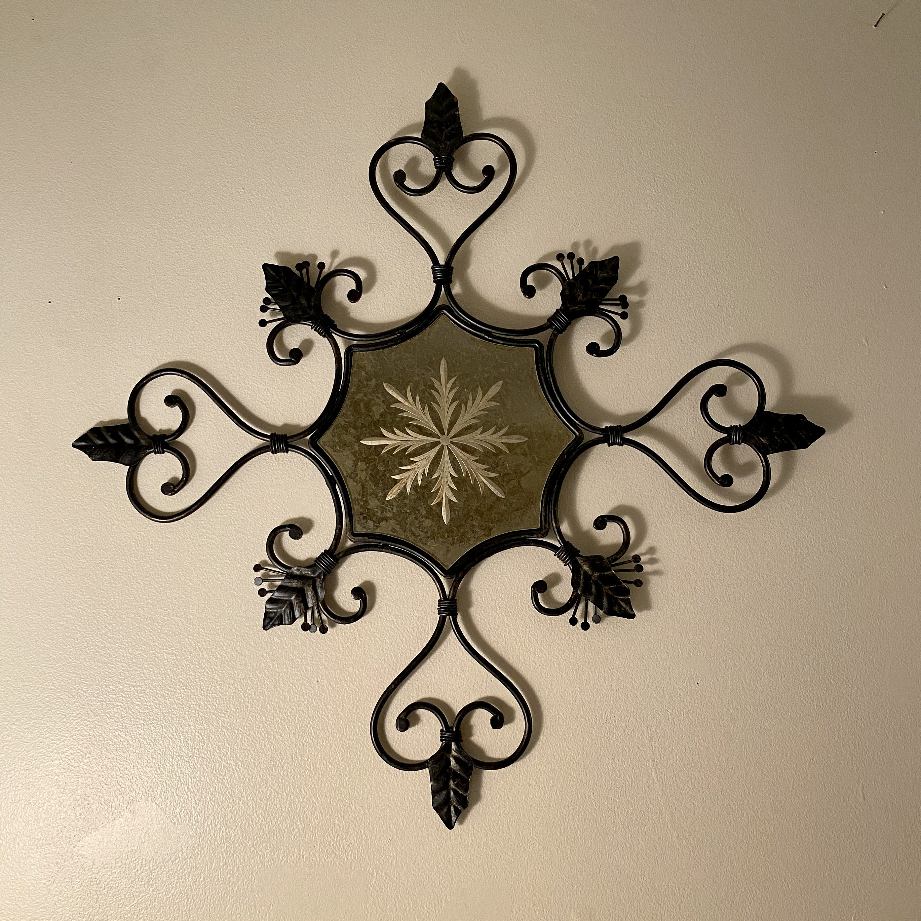 Black metal scroll medallion wall art with antiqued mirror Etsy