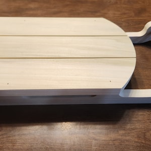 Grote decoratieve houten slee