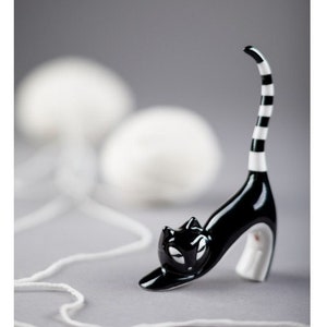 Porcelain cat figurine,  a cat stretching, porcelain figurine of a black and white kitten, original figurine from Ćmielów, the cat bends