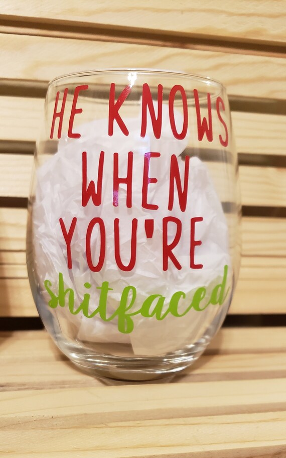 He sees you when you're drinking. Wine glass for Secret Santa gift.