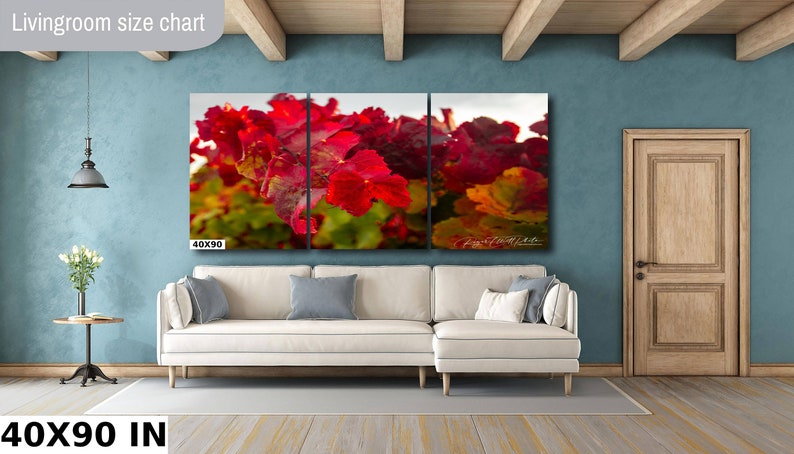 Close-up photo of vibrant red grapevine leaves in autumn, capturing the rich colors and textures of the harvest season. The bright, detailed foliage makes a striking and warm addition to any home decor, perfect for celebrating the beauty of fall.