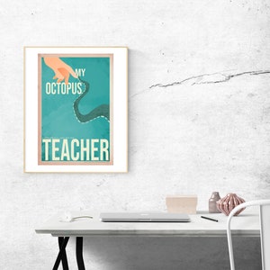 May include: A teal blue poster with a white frame. The poster features a hand pointing to a stylized octopus with the text "My Octopus Teacher" in white.