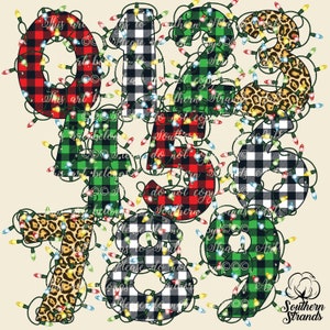 May include: Numbers 0 through 9 are decorated with red and black buffalo plaid, green and black buffalo plaid, and leopard print. Each number is surrounded by a string of colorful Christmas lights.