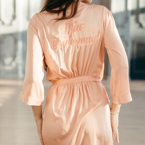 Handmade personalized bridesmaid robe with name embroidery monogrammed at the back of the dressing gown.