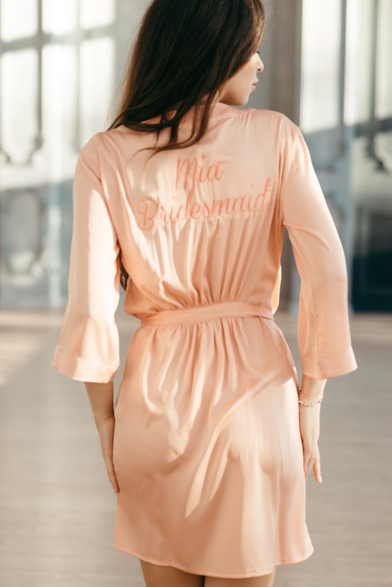 Handmade personalized bridesmaid robe with name embroidery monogrammed at the back of the dressing gown.