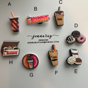 May include: A set of 10 Dunkin' Donuts themed shoe charms. The charms feature various Dunkin' Donuts products, including coffee cups, donuts, and a box of donuts. The charms are made of a soft, flexible material and are perfect for adding a touch of fun to your shoes.