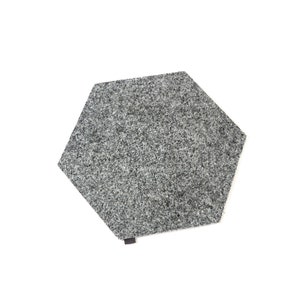 May include: A gray hexagonal rug with a fuzzy texture.
