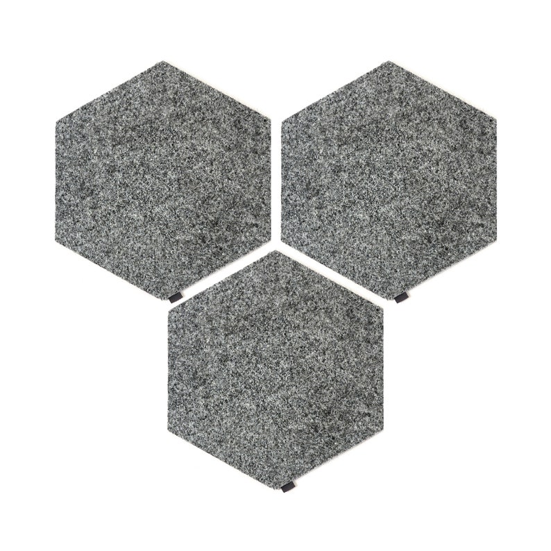 May include: Three gray hexagonal floor tiles with a textured surface.