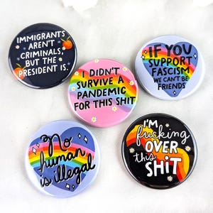 No Human is Illegal - Pinback buttons - Anti fascism pins - Protest buttons - Resist buttons - Equality button - Social justice buttons