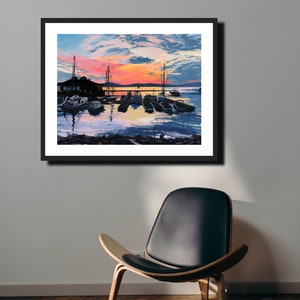 May include: A painting of a harbor at sunset with boats docked at a pier. The sky is a vibrant orange and pink with clouds. The water is calm and reflects the colors of the sky.