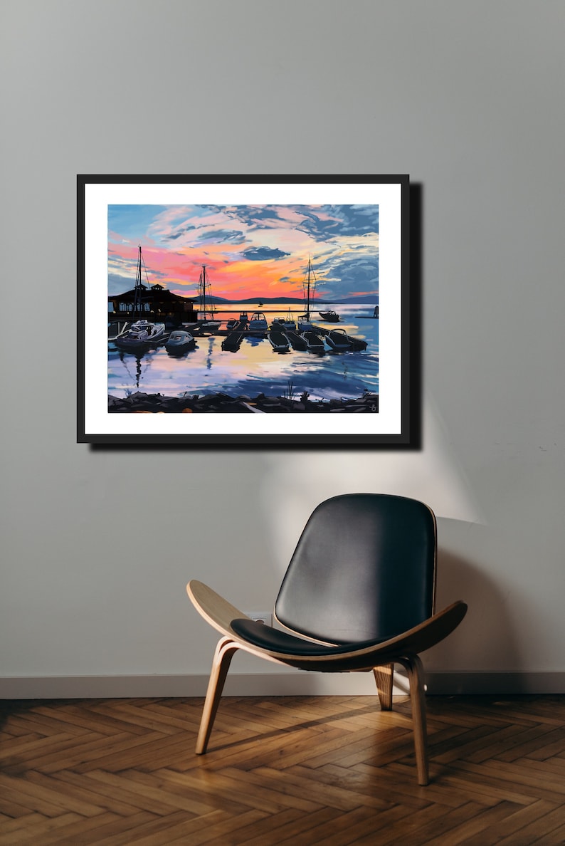 May include: A painting of a harbor at sunset with boats docked at a pier. The sky is a vibrant orange and pink with clouds. The water is calm and reflects the colors of the sky.