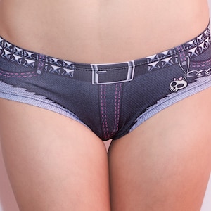 May include: Black and grey underwear with a denim print, a pink stitched seam, a silver chain, and a skull charm.