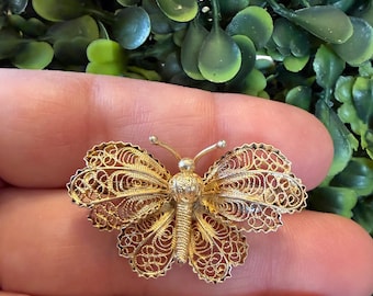 Broche vintage en filigrane d'argent 800 ornée d'épingles à