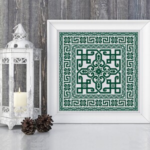 May include: A framed cross-stitch design with a green geometric pattern on a white background. The design features a central square with intricate details and a border of repeating motifs.