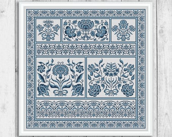 May include: A blue and white cross stitch pattern with a floral design. The pattern is framed in a white frame and is ready to be stitched.