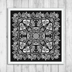 May include: Black and white embroidery design featuring a symmetrical pattern of stylized flowers and leaves. The design is framed in a square border.