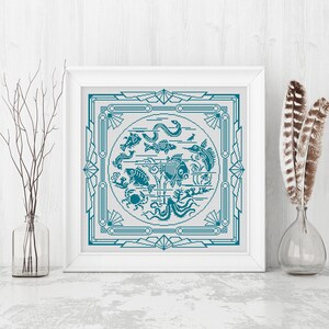 May include: A framed cross-stitch design featuring a teal blue circle with various stylized fish and sea creatures, surrounded by a decorative teal blue frame.