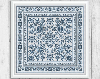 May include: A blue and white cross stitch pattern with a floral design. The pattern is framed in a white frame.