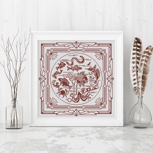 May include: A framed cross-stitch design featuring a red and white geometric pattern with a circle in the center. The circle contains a variety of sea creatures, including fish, a crab, an octopus, and a seahorse.