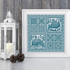 May include: A framed cross-stitch design featuring a blue and white castle scene with intricate floral patterns. The castle is surrounded by a border of small squares and the design is framed in white.