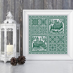 May include: A framed green and white cross-stitch embroidery featuring a castle and floral designs. The embroidery is in a white frame with a white mount.