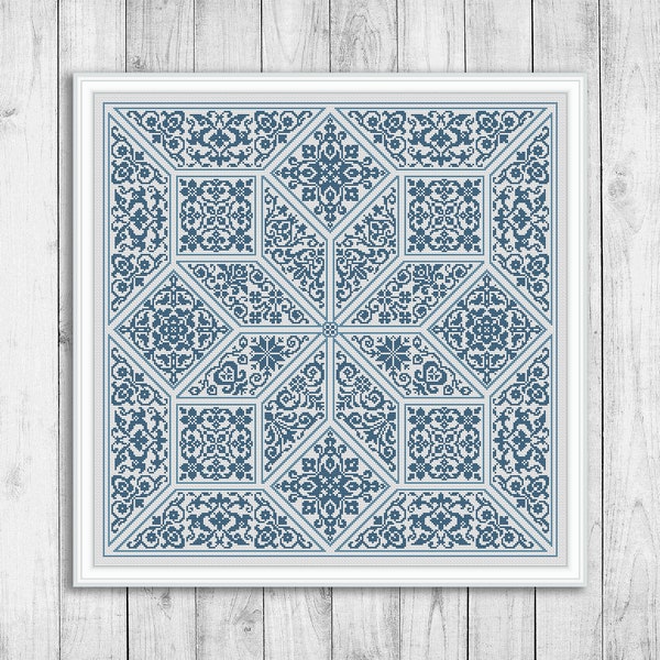 May include: A blue and white geometric pattern cross stitch design in a white frame.