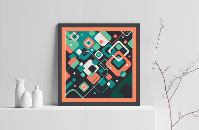 Pode incluir: Impress&atilde;o de arte geom&eacute;trica abstrata com fundo preto e quadrados e ret&acirc;ngulos coloridos em tons de verde, azul, laranja e branco. A impress&atilde;o &eacute; emoldurada em uma moldura preta com uma borda interna coral.