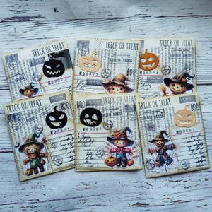 May include: A selection of Halloween cards, each displaying "TRICK OR TREAT" and adorned with pumpkin and scarecrow illustrations. The cards have a vintage aesthetic, incorporating postage stamps and handwritten text.