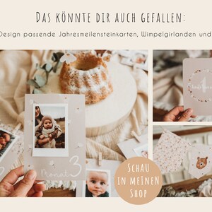 Peut inclure: Ensemble de cartes &eacute;tapes pour b&eacute;b&eacute;, une guirlande et d'autres &eacute;l&eacute;ments d&eacute;coratifs. Les cartes pr&eacute;sentent des photos et les mois 1, 2 et 3. La guirlande a un motif d'ours. Le texte "DAS K&Ouml;NNTE DIR AUCH GEFALLEN" est visible.