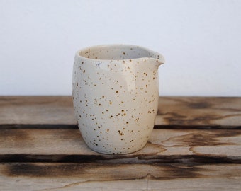 Small creamer made from white speckled stoneware clay