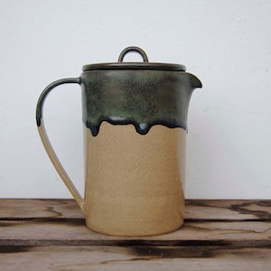 Pitcher with lid and drippy dark blue glaze