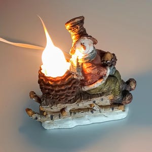 Adorable Snowman Plug in Light Up Figurine!