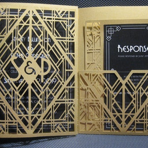 May include: Gold and black wedding invitation with a geometric design. The invitation features the couple's names, the date of the wedding, and the location. The response card is included in the invitation.