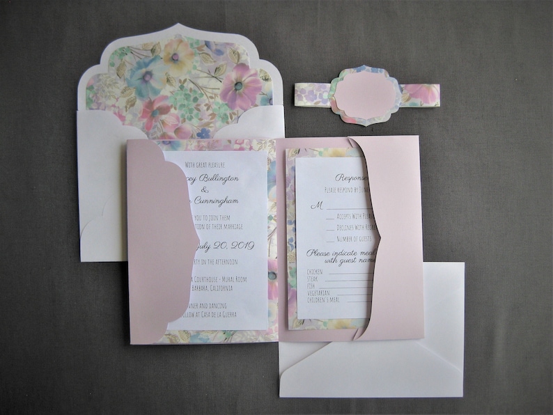 May include: A pink and white wedding invitation with a floral design. The invitation includes the names "Casey Bullington & Cunningham" and the date "July 20, 2019".