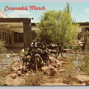 May include: A bronze sculpture of a group of people on horseback, titled "Coronado's March", is displayed in a shopping mall courtyard. The sculpture is surrounded by a small stream and landscaping.