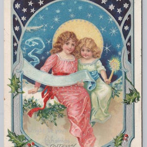 Cartolina luminosa di Natale con ragazze tedesche Holly c1908
