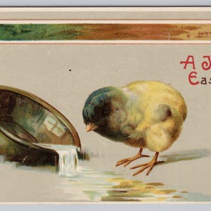 Una gioiosa cartolina antica di Pasqua, pulcino, acqua potabile