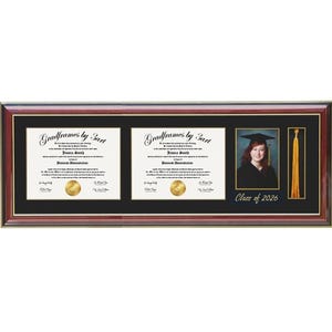 May include: A graduation frame with a dark wood finish, holding two diplomas, a photo of a graduate, and a gold tassel. The frame includes the text "Class of 2026". The diplomas have gold seals.