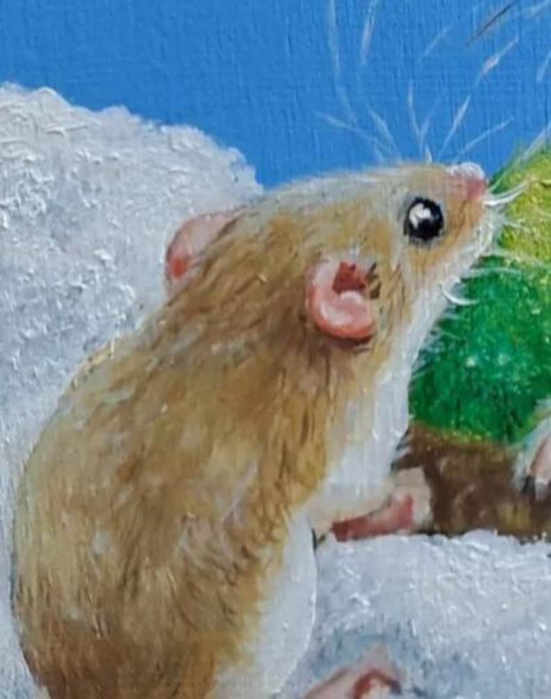 May include: A detailed painting of a small mouse with tan fur, pink ears, and a pink nose. The mouse is set against a backdrop of white and green, with a bright blue sky in the background. The artwork has a soft, painterly style.