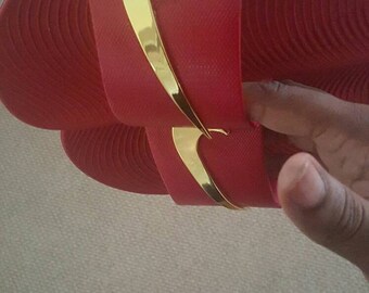 red nike sandals with gold check