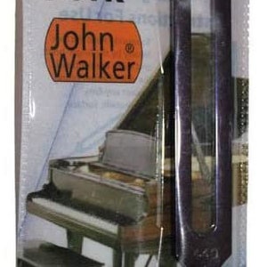 May include: A black tuning fork in a clear plastic bag with a red header. The bag features the text "Tuning Fork", "John Walker", and "RAGG".