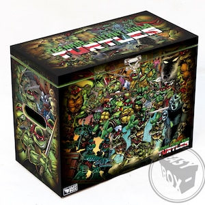 May include: A black wooden storage box featuring a Teenage Mutant Ninja Turtles comic book cover design. The box has a hinged lid with a metal latch and a handle on the side. The box is labelled "Teenage Mutant Ninja Turtles" on the front and "Easy Box" on the bottom.