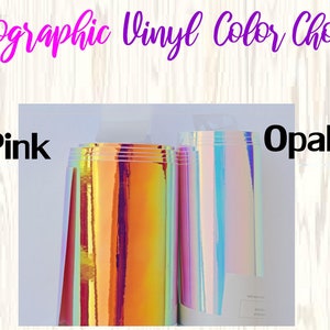 May include: Image showcasing rolls of holographic vinyl in pink and opal colors. The text "Holographic Vinyl Color Choices" is displayed at the top, with "Pink" and "Opal" labeling the vinyl rolls. The vinyl has a shiny, iridescent finish.