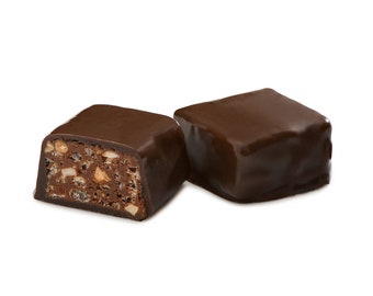May include: Two chocolate-covered candies, one broken open to reveal a crunchy, nutty filling.
