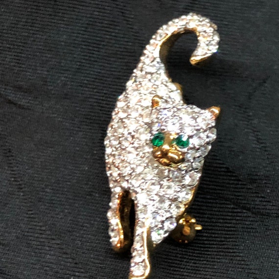 Vintage Rhinestone cat brooch pin with green eyes - image 1