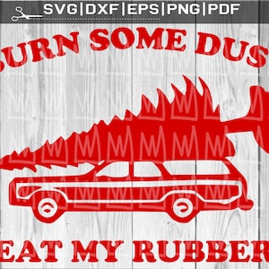 May include: Red graphic of a station wagon with a Christmas tree on top, featuring the text "BURN SOME DUST" and "EAT MY RUBBER". The design is set against a white wood grain backdrop.