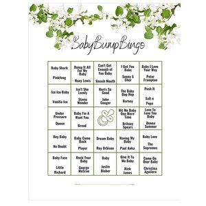 May include: A green and white bingo card with the title "Baby Bump Bingo". The card features a variety of songs and phrases related to babies, including "Baby Shark", "Ice Ice Baby", "Baby Come Back", and "Baby Love".